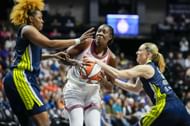 Tina Charles #31 of the Connecticut Sun is double-teamed by former Wings star NaLyssa Smith #1 and ROTY Paige Bueckers #5 during the first half at Mohegan Sun Arena on May 27, 2025 in Uncasville, Connecticut. - Source: Getty